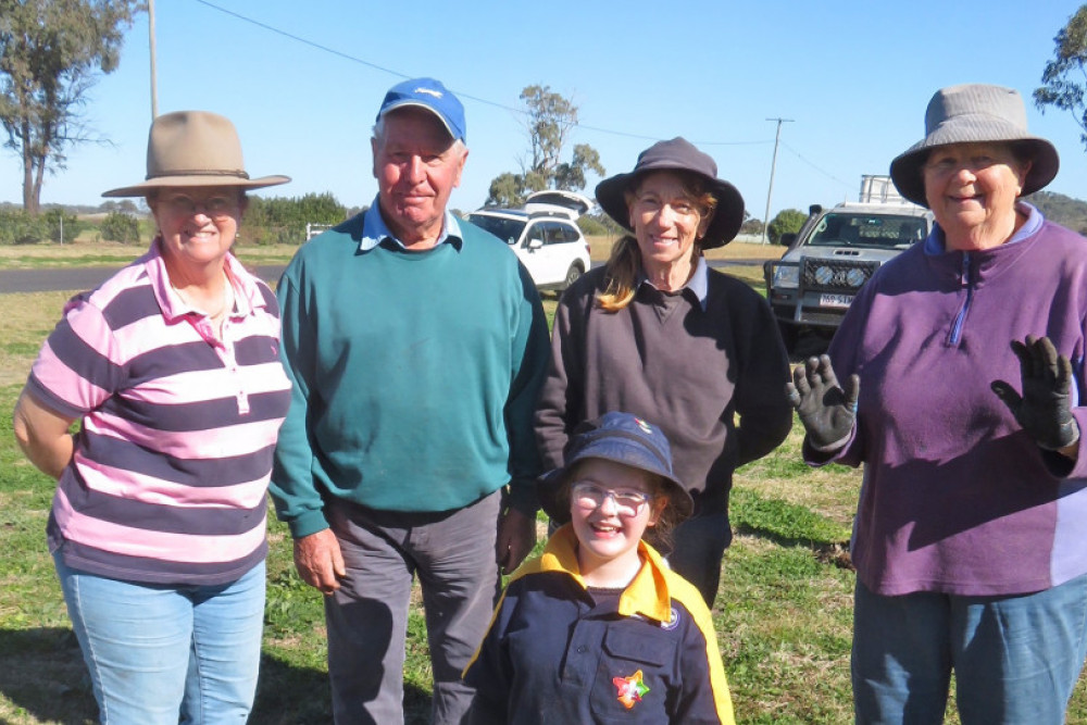 Job done! Planting the last of 85 trees along Boundary Road on Sunday morning are Landcare volunteers (from left Theresa Tickell, John Dade, Cathy Proud and Sue Dade with youngster Sofia Thornber.