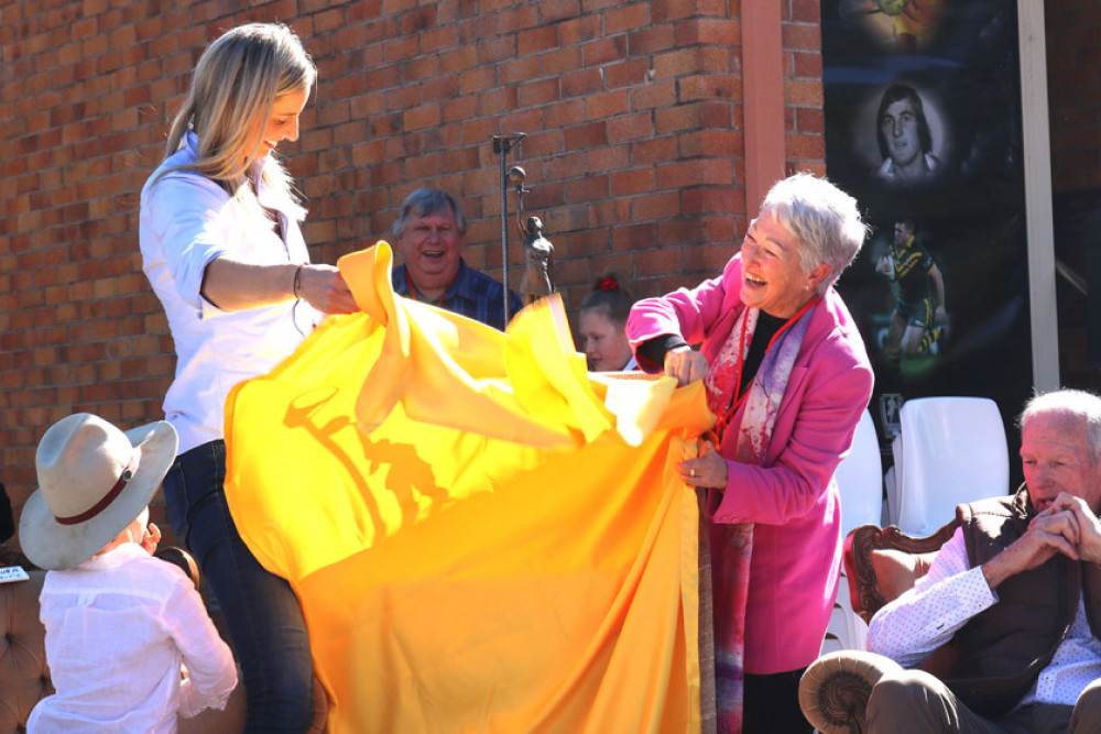 A gust of wind arrived just as the unveiling was about to happen, hence the fun photo. The super coach and local Allora hero Wayne Bennett sat by in his comfortable arm chair.