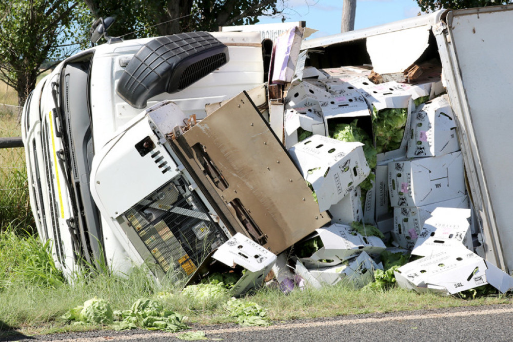 The wreckage after a truck carrying lettuce overturned.