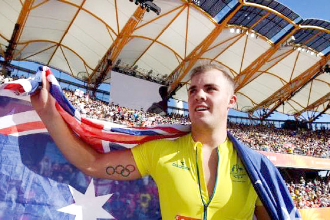 Matt Denny representing his country at the 2018 Commonwealth Games on the Gold Coast, where he won a silver medal in hammer throw and placed fourth in discus throw.