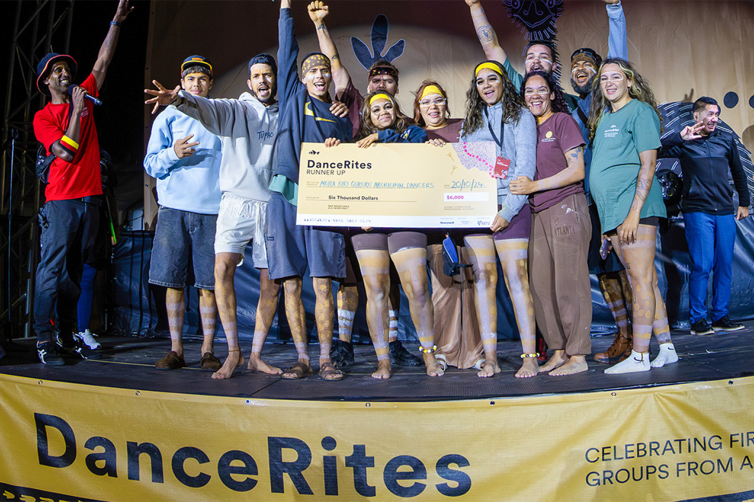 The Mura Biri Gururu Dancers receive their award at Sydney Opera House. Back Row: Thira Mayinj, Thaata Pakul Miri and Thulaida. Front Row (Left to Right): Burrgu, Milkiri, Guliya, Kukay, Thikarri, Thangku, Yirrinj and Kantikay.