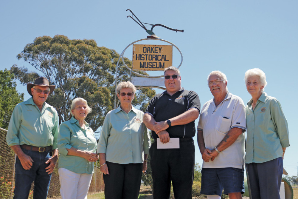 Michael Carpenter and John Webster (centre) present a cheque to the Oakey Historical Museum representatives Harold Kowitz, Joyce Gardner, Norma Byers and Fay Telford.