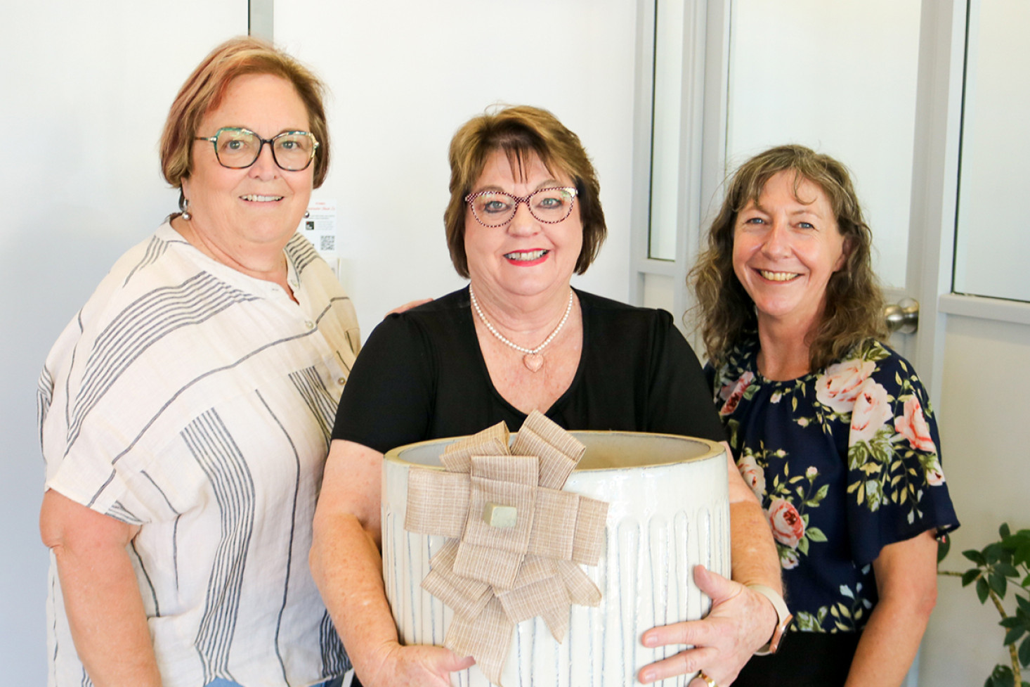 Rhonda Ashton and Belinda McKinlay of the Pittsworth District Alliance presented Colleen Playford (centre) with a pot and a plant voucher in recognition of her 33 continuous years at NAB Pittsworth.