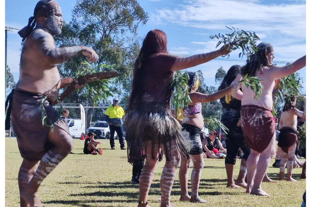 Three dancers Karntu-Marlanj, Thikarri, Gamul perform a cultural dance at the Federal Sporting Fields.