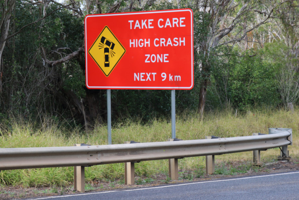 The stretch of New England Highway that passes through Hodgson Vale carries a number of signs urging motorists to slow down and take care.