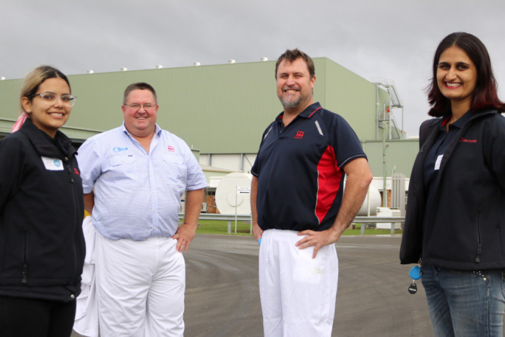 Oakey Beef Exports general manager Grant Coleman (second from left) with HR coordinator Nathalia Barbosa, engineering manager Justin Caldwell and environmental engineer Aaditi Dang. The imposing, newly commissioned cold storage facility is in the background.