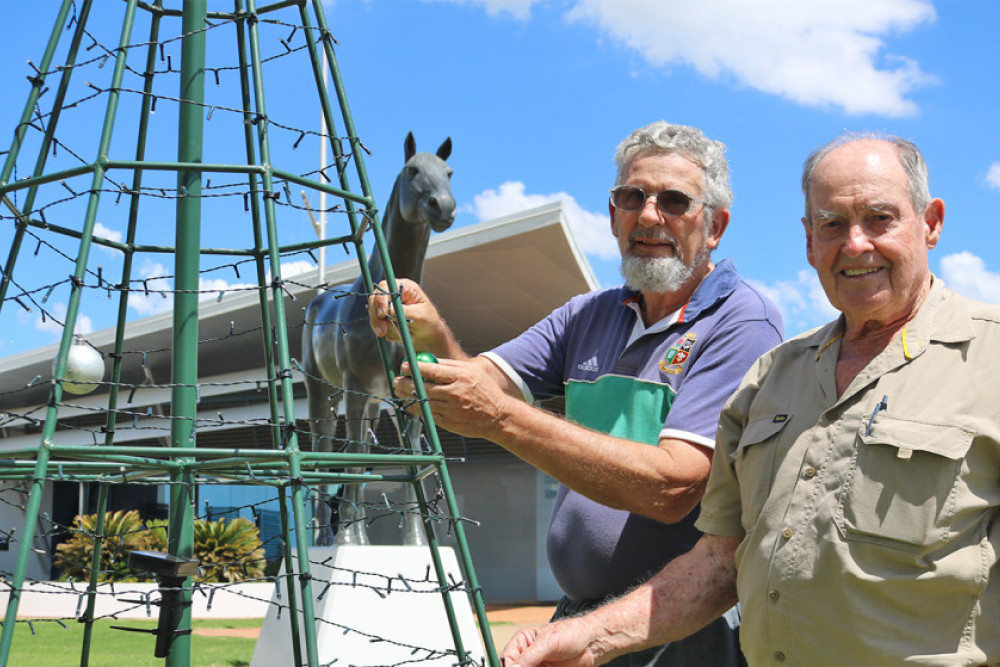 Oakey Men’s Shed members Graeme Garvis and John Greenhalgh with the Oakey community Christmas tree.