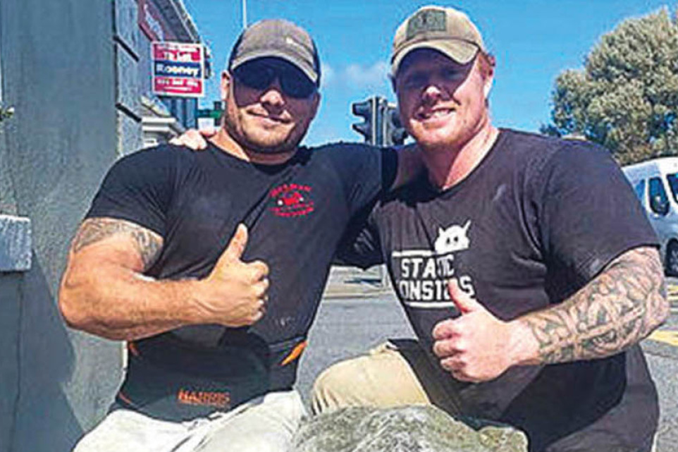 Soldiers Corporal Luke Keiger and Sergeant Conor Reilly with an Irish stone after the Natural Strongman World Championships in Galway, Ireland.