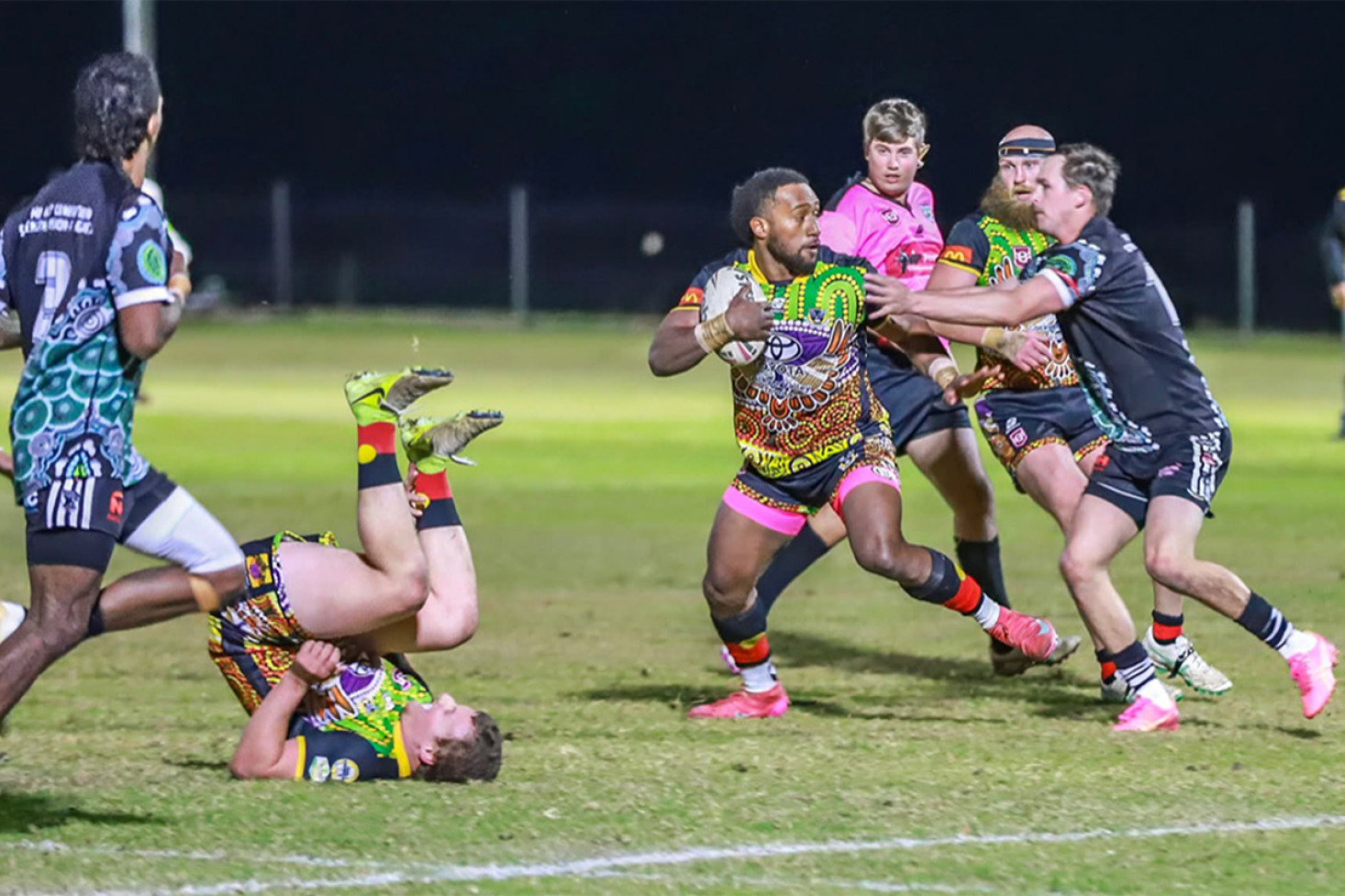 TOPSY TURVY: Both teams put their bodies on the line in a physical encounter. Photo, Ann Bichell
