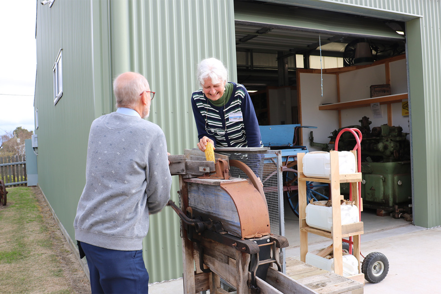 Museum volunteers Barrie Jones and Linda Nicholas demonstrate a corn shelling machine which is one of many live exhibits on the day.