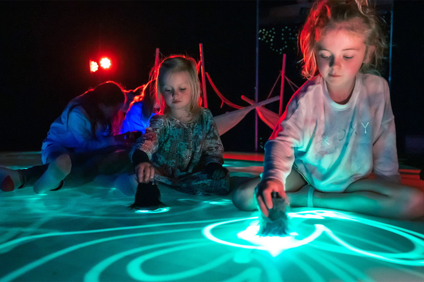 THRIVE Festival includes Sea of Light, an illuminating interactive visual experience where participants use a UV torch as their paintbrush, immersing themselves in a journey of light and imagination. Photo, Matt Byrne