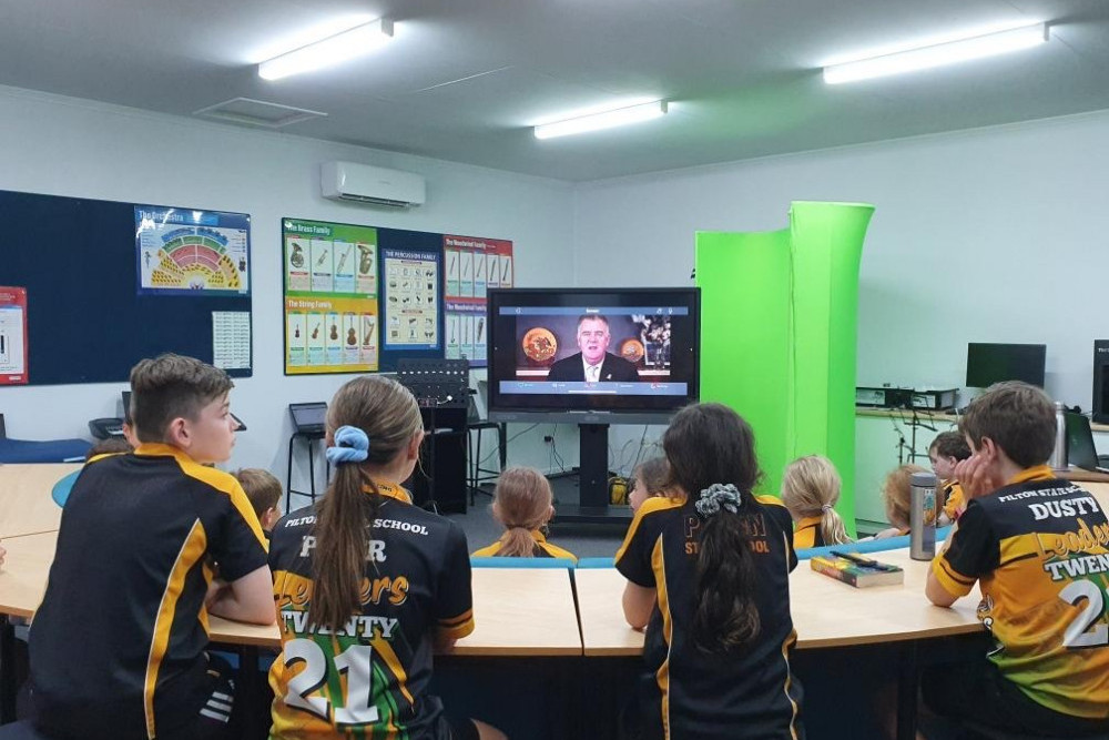 Students anxiously watch on as Minister Furner announces the winners.