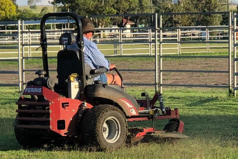 Barry Standing hard at work atop the new Ferris Mower.