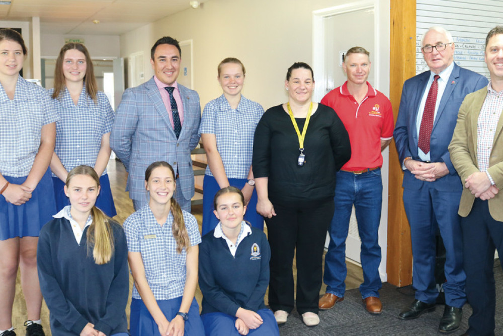 In the front row (from left) are Pittsworth State High School Hospitality Students Chiara Gunning, Kiera Macdonald and Victoria Neilsen. In the back row (from left) are Caitlin Stace, Jorja Shelberg, Cr James O’Shea, Abbie Summers, Founder of Emerge Jen Shaw, Chaplain at Pittsworth State High School Jason Beattie, Toowoomba Region Mayor Paul Antonio and Pittsworth State High School Principal Rob Michel.