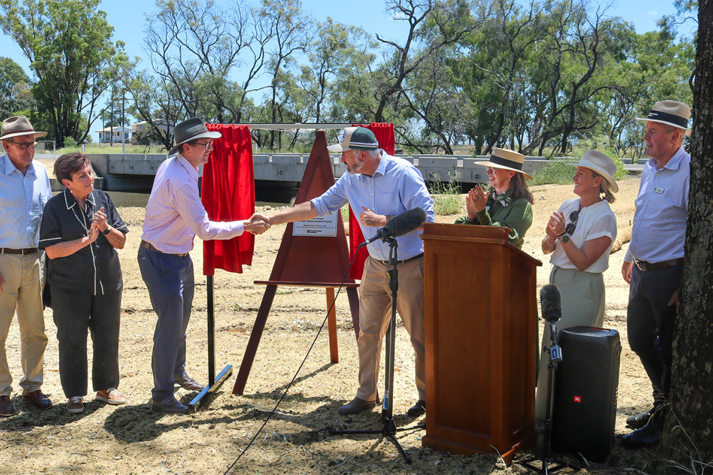 Toowoomba Region Mayor Geoff McDonald shook hands with Senator Anthony Chisholm, Assistant Minister for Regional Development, at the official opening of the Melrose Road Bridge on Thursday, 30th January. Mr McDonald was supported by councillors (from left) Kerry Shine, Carol Taylor, Melissa Taylor, Edwina Farquhar and Trevor Manteufel.