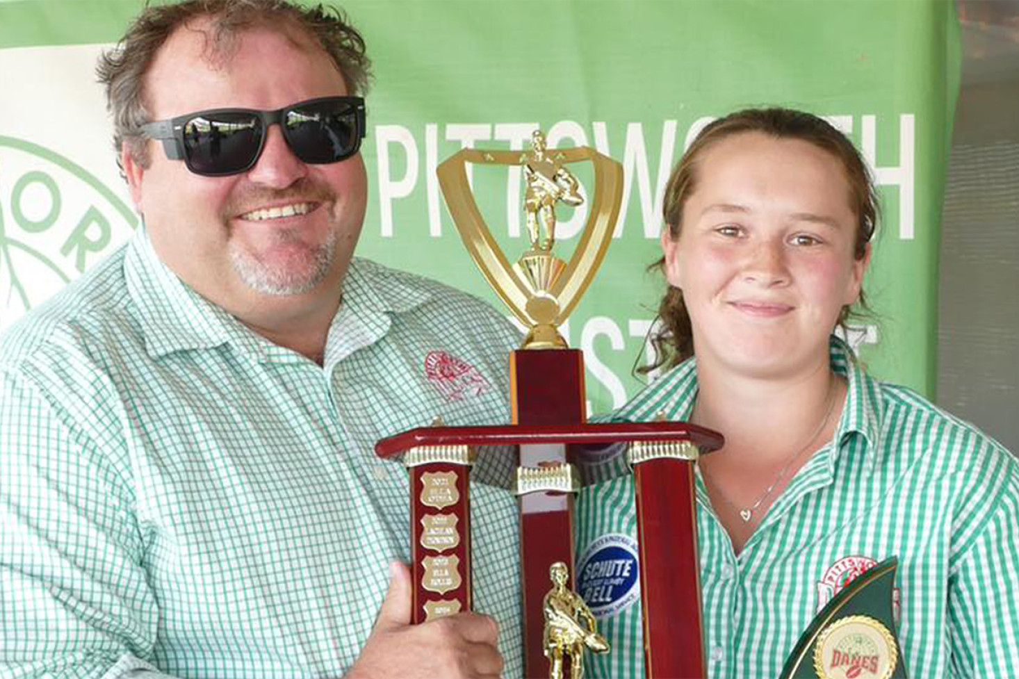 Angela Robertson received the Pittsworth Leagues Club perpetual trophy for Player of the Year, presented by PDJRL President Grant Trott.