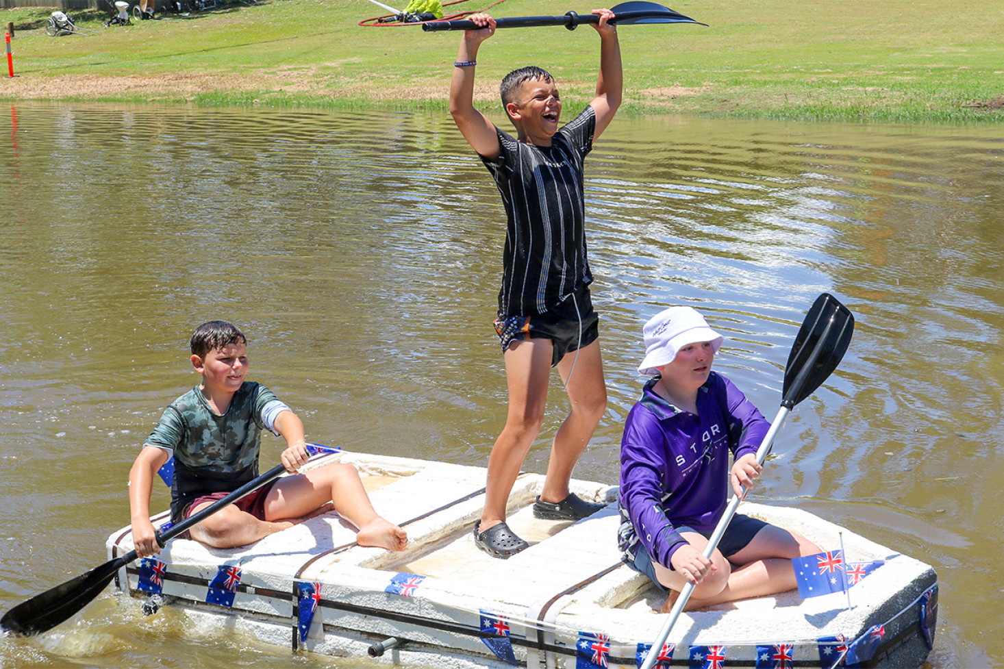 Junior raft racers complete the Oakey Creek course in 2023.