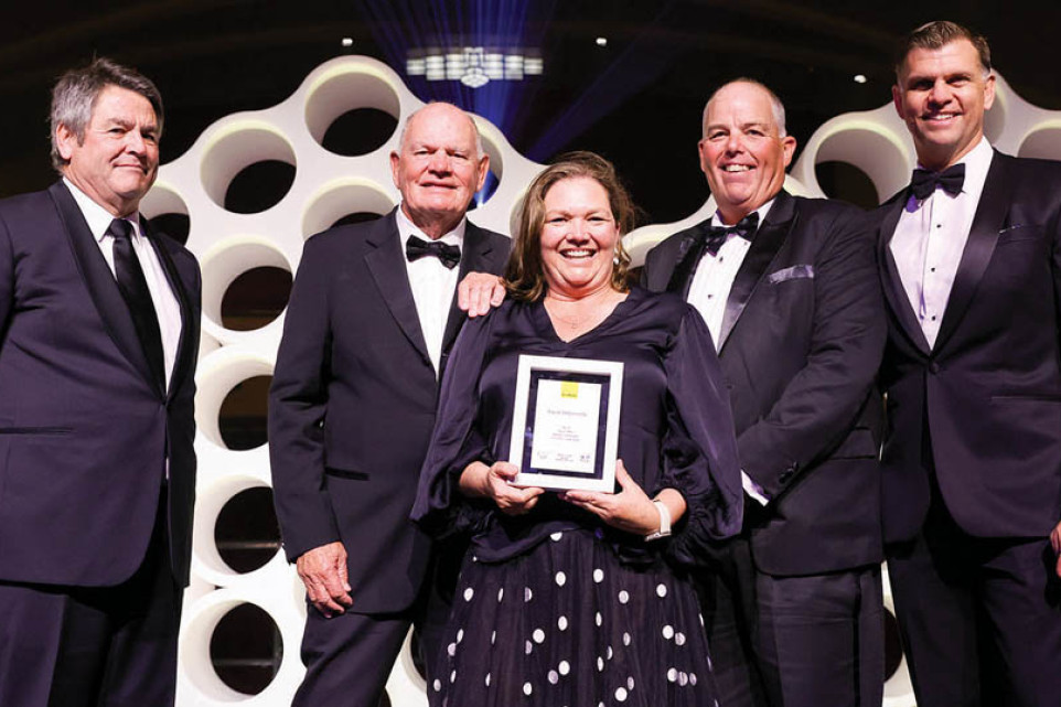 James and Sally Croft (centre) received an award for being in the Top 10 Offices for Settled Commission for the 23-24 financial year.