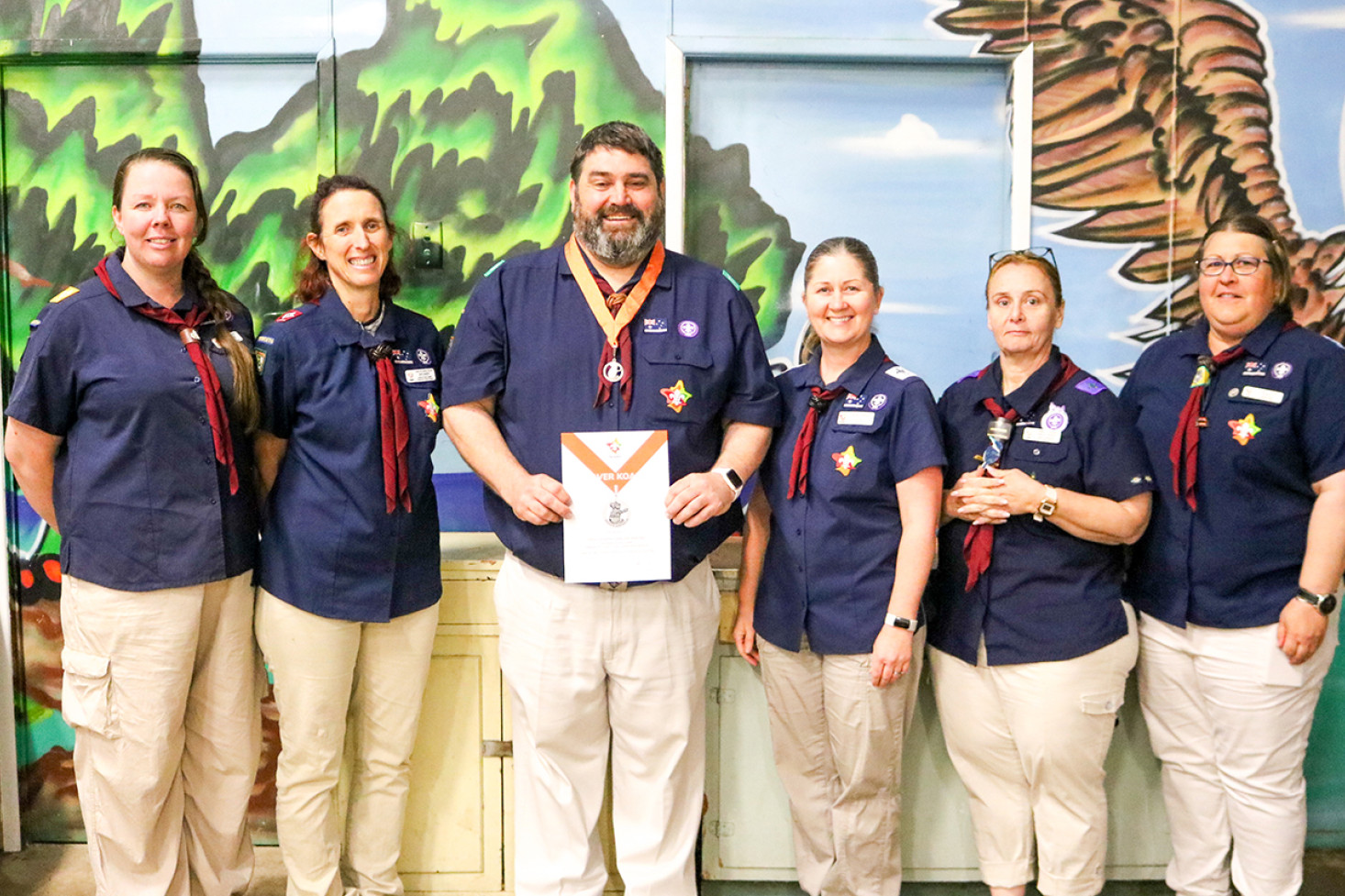 Cub Scout Leader Nicole Sacagio, Venturer Scout Leader Taryn Binstead, Assistant Scout Leader Paul Drummond with his Silver Koala, Group Leader Stacey Schultz, Beauaraba District Commissioner Leanne Fitzgerald and Beauaraba District Leader Carol Cann.