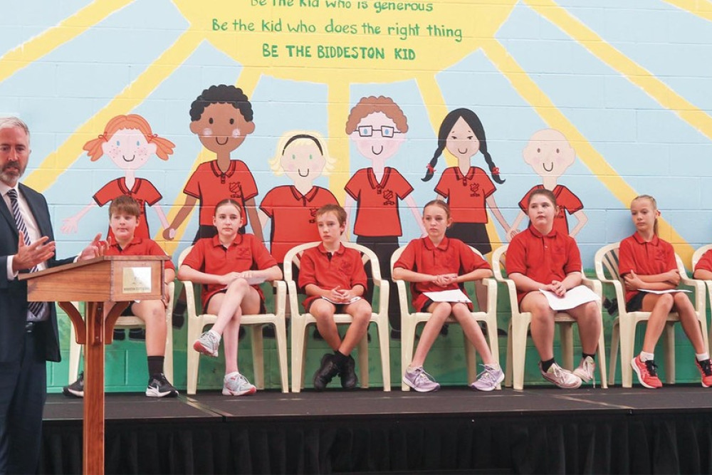 ABOVE: Federal Assistant Minister for Education Anthony Chisholm makes a brief address to students and parents at Biddeston State School.