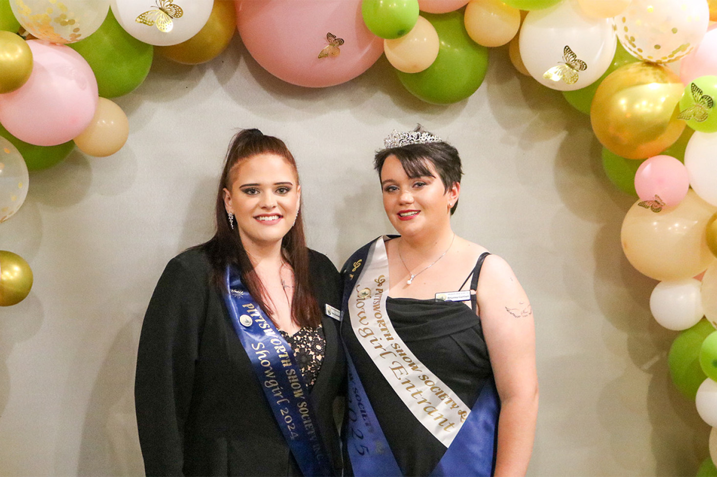 The Show Society’s 2025 Showgirl, Brianna Gartner, received her sash from last year’s Showgirl, Beccy Karlisch (left).