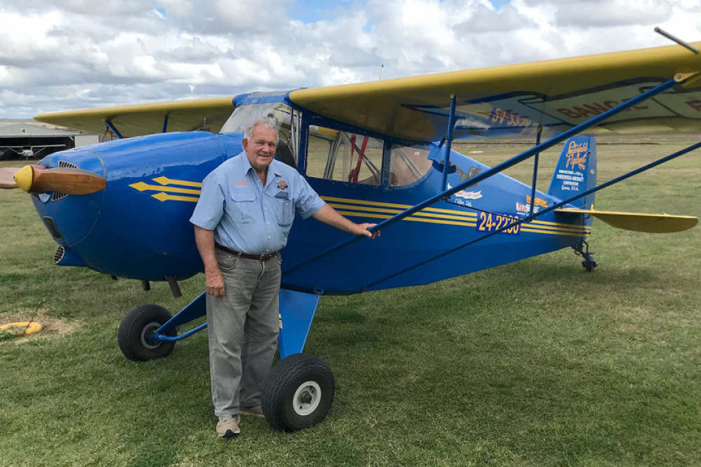 Trevor Bange with the Porterfield aircraft once owned by Australian airline pioneer Sir Reginald Ansett, and later purchased by Trevor’s father, Jack Bange.