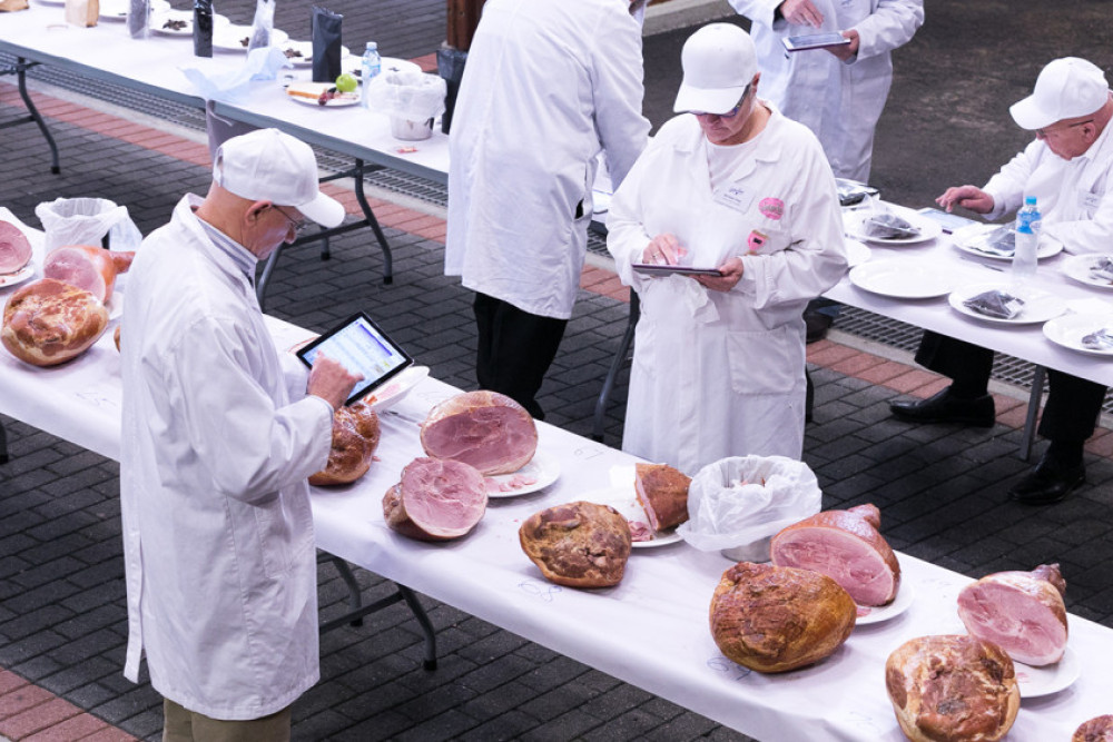 The Sydney Royal Fine Food Show covers a range of Australian-produced foods including sections for Branded Meat, Oil and Olives, Pasta, Specialty Foods, Professional Bakery, Aquaculture and Smallgoods and Charcuterie, judging in the latter section was proceeding when this photograph was taken.