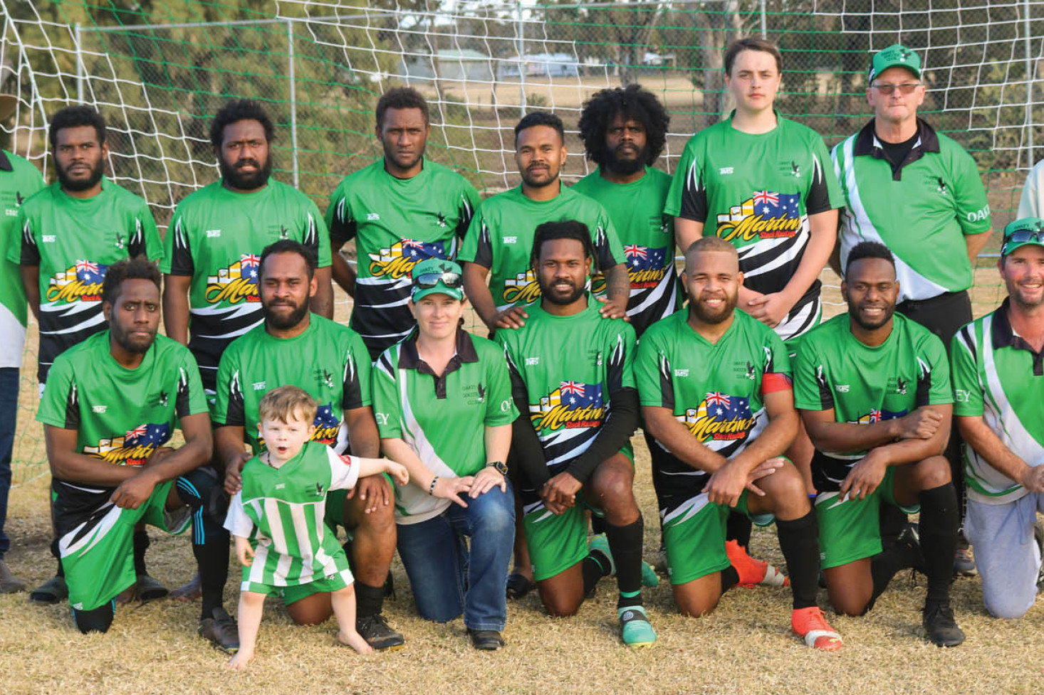 ABOVE: Back Row (L-R) David Laybutt (Assistant Coach), Charles, Petros, Roy, Gerald, Isimeli, Konan, Tony James (coach), Luckins. Front Row (L-R) Eric, Remi, Kate Gilliespie (President), Junior, Lensley, Gene David Gillespie (Vice President). Mascot - Eddie