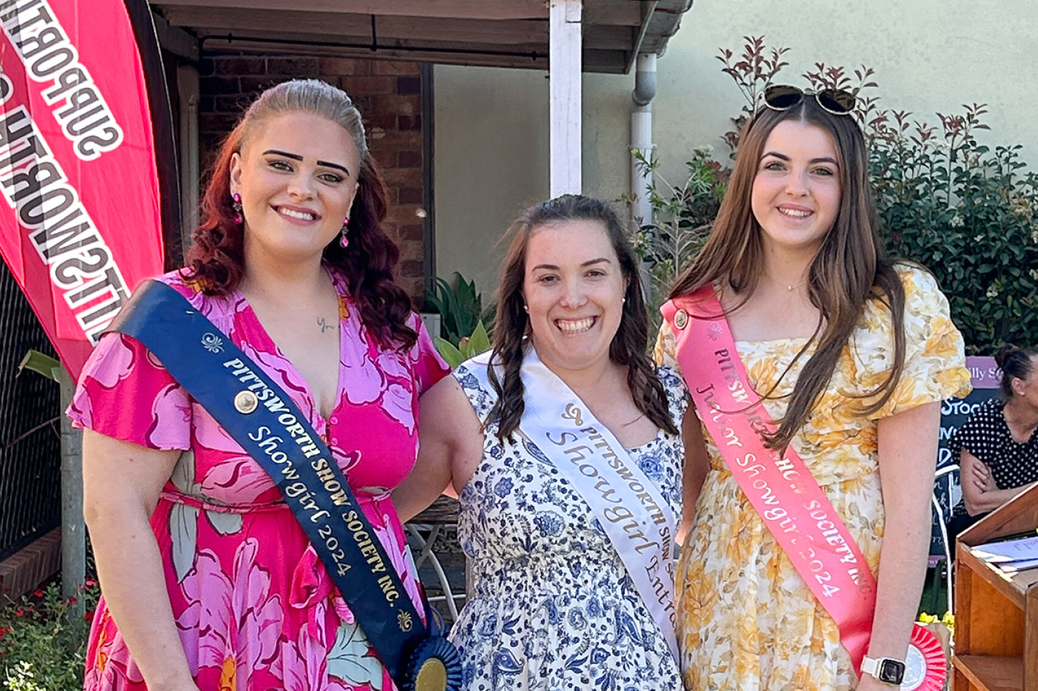 2024 Showgirl Beccy Karlish and 2024 Junior Showgirl Jessica Hegarty with 2025 Showgirl entrant Sophie Lack (centre).