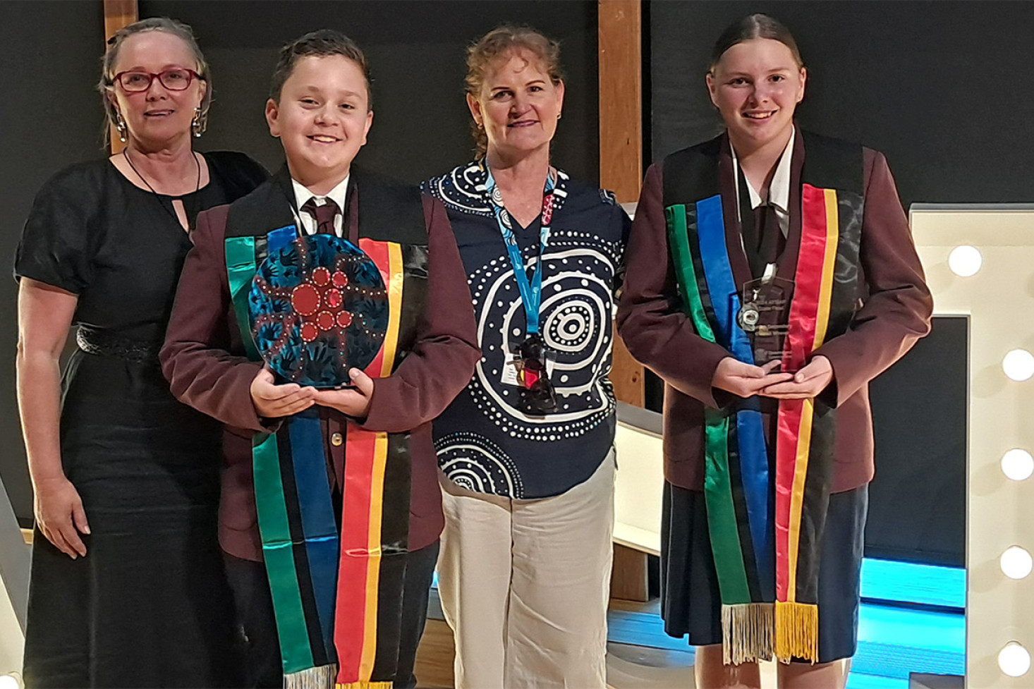 Natalie Docherty (Community Partnerships Officer, First Nations Partnerships and Programs Darling Downs South West Region, Department of Education) with Fletcher, Linda Sharman and Rikaya.