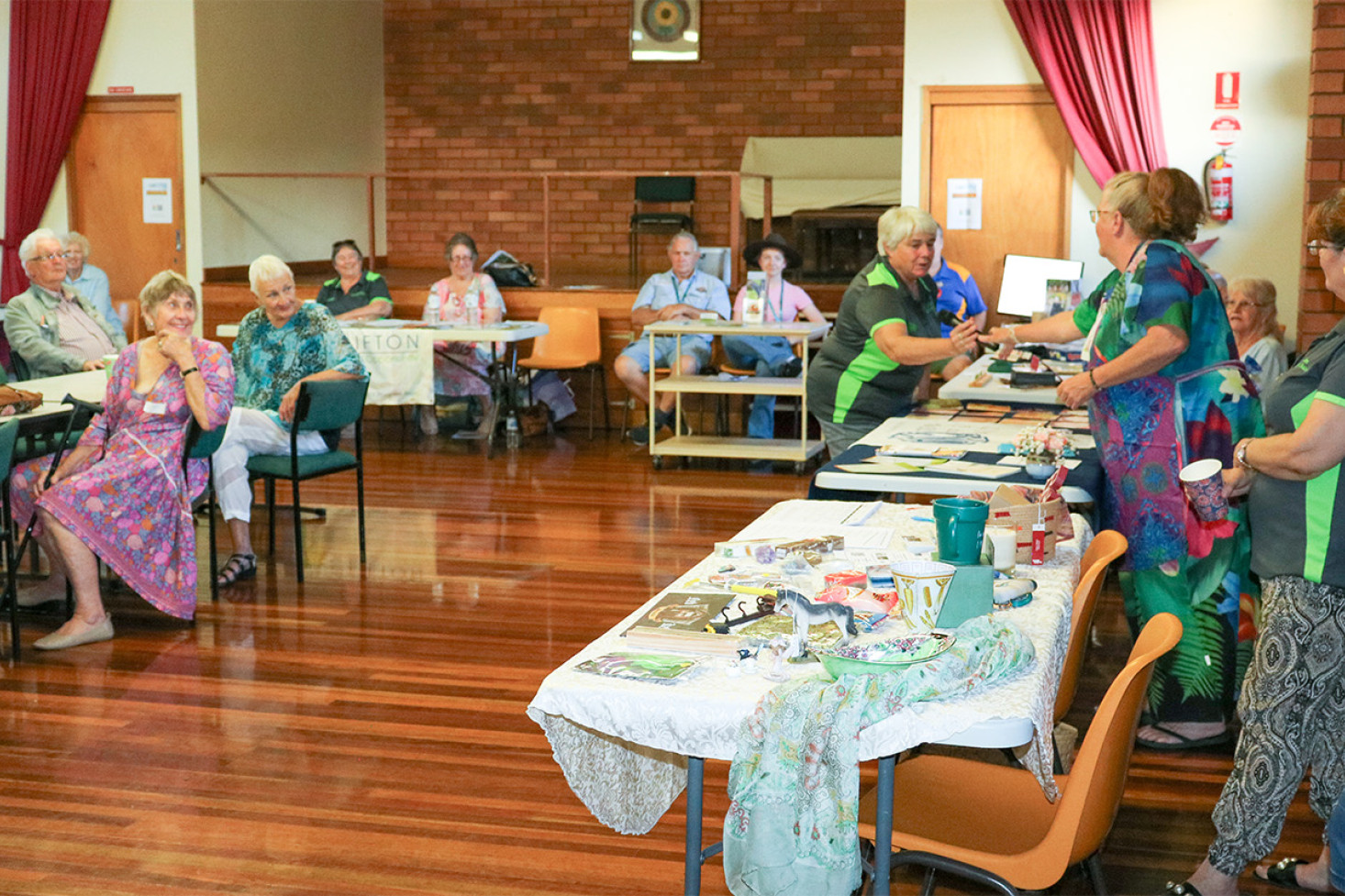 A representative from each organisation was given a chance to speak about their group, as Tracey Brooker from the Clifton CWA branch hands the microphone to Clifton and District Progress Association President Margaret May.