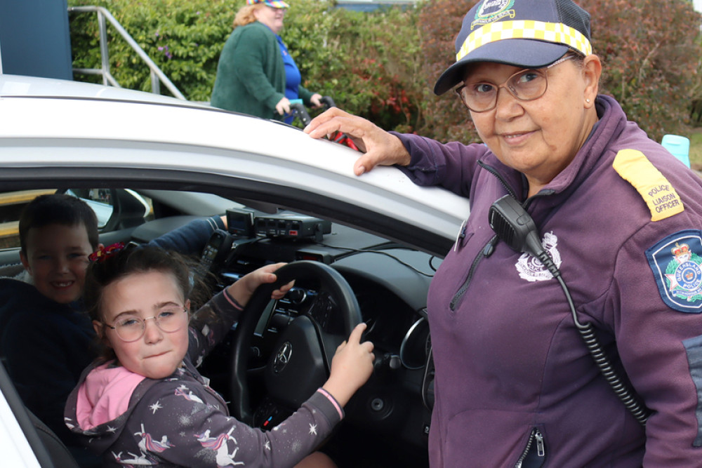 At the Under 8s day, Piper and Harry enjoy getting behind the wheel of a police car with police liaison officer Mandy Bahr.