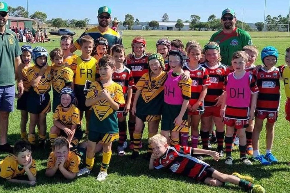 Wattles Under 8 line-up share centre stage with their Pittsworth Danes opponents after their pre-season trial on Saturday morning. Photos, Aaron Gilmore