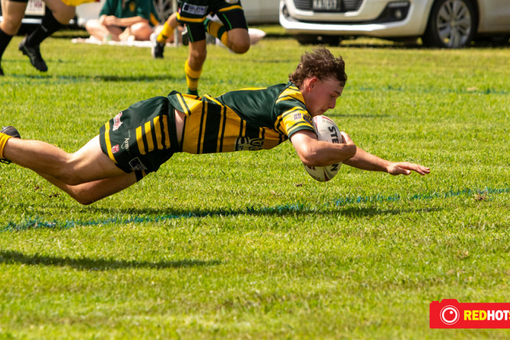 Wattles Under 19 halfback Rylan Saville dives over for the match sealing try against Valleys at Platz Oval on Sunday. Photo, REDHOTSHOTZ