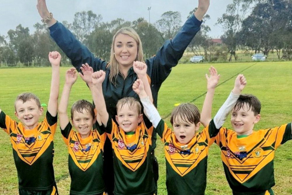 Wattles Under 6 enjoying a wet game on Saturday. Chaz Daley, James Patterson, George Mullen, Henry Ferguson and Archie Moore with Coach Shadai Daley.