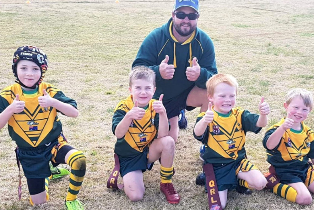 Wattles Warriors Under 6 players Braxton Harper, Jace Macura, Lawson McPherson and Hunter Gault with coach Jared Gault are all mighty happy with their team’s fifteen try haul against Stanthorpe.