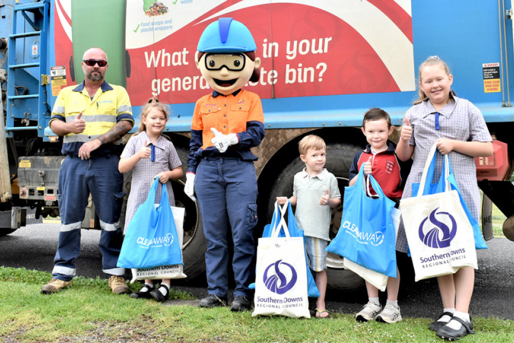 Left to right, the excited Williams kids - Mahailia, Kaiden, Leo and Molly with their goody bags full of treasures delivered to their home by the Council’s waste mascot and rock star Sort-It-Sally.