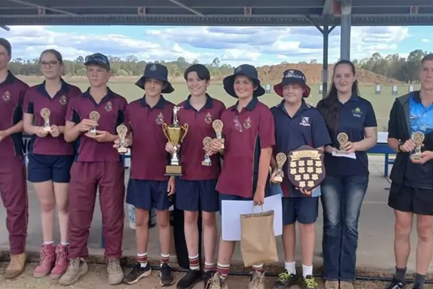 The prize winners, from left: Dom Faggotter (T.A.S), Georgia Cairns (T.A.S), Sam Wippell (T.A.S), Jack Baguley (T.A.S), Will Baguley (T.A.S). George Douglas (T.A.S), Beau Taylor (C.S.H.S), Rebekah Robinson (Benchrest Rifle Club) and Nathaniel Knight (Oakey).