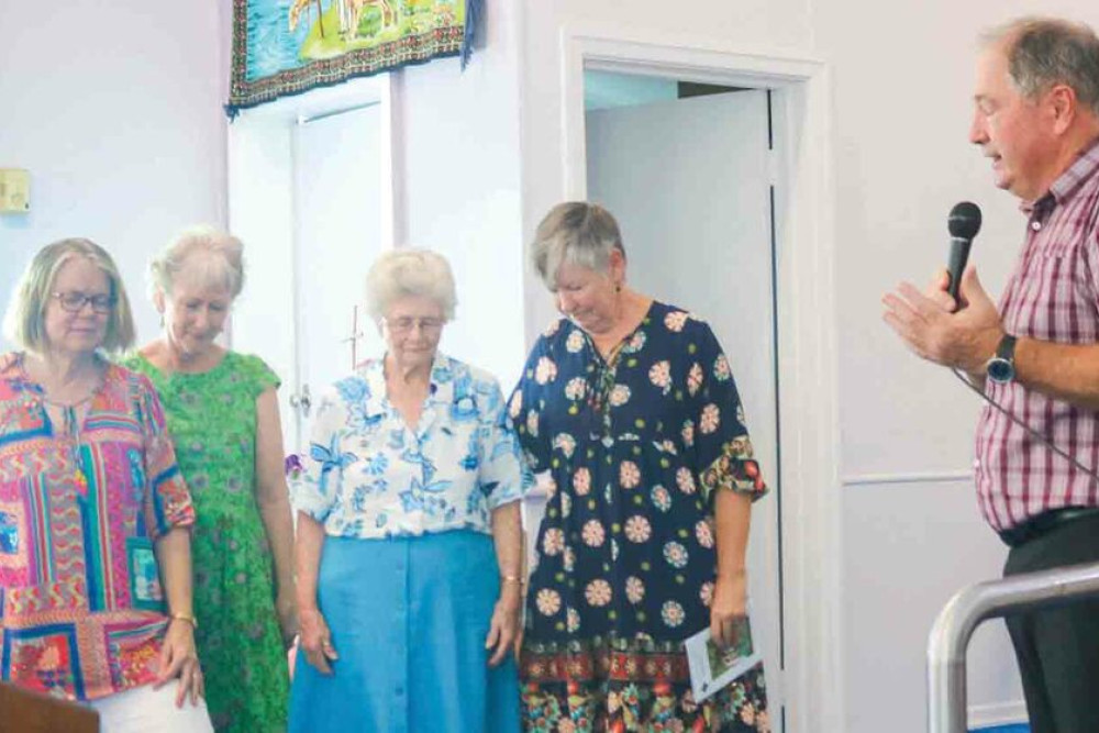 ABOVE: St. Paul’s Lutheran Church’s Pastor Ken Schultz says a prayer as the baton is passed from St. Pauls to Oakey Uniting Church for the 2025 event.