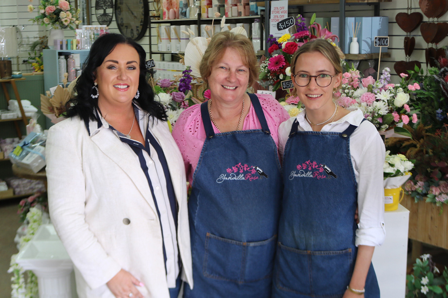 New owner Rachael Keeley, departing owner Donna Ariell and continuing head florist Hannah Currell.