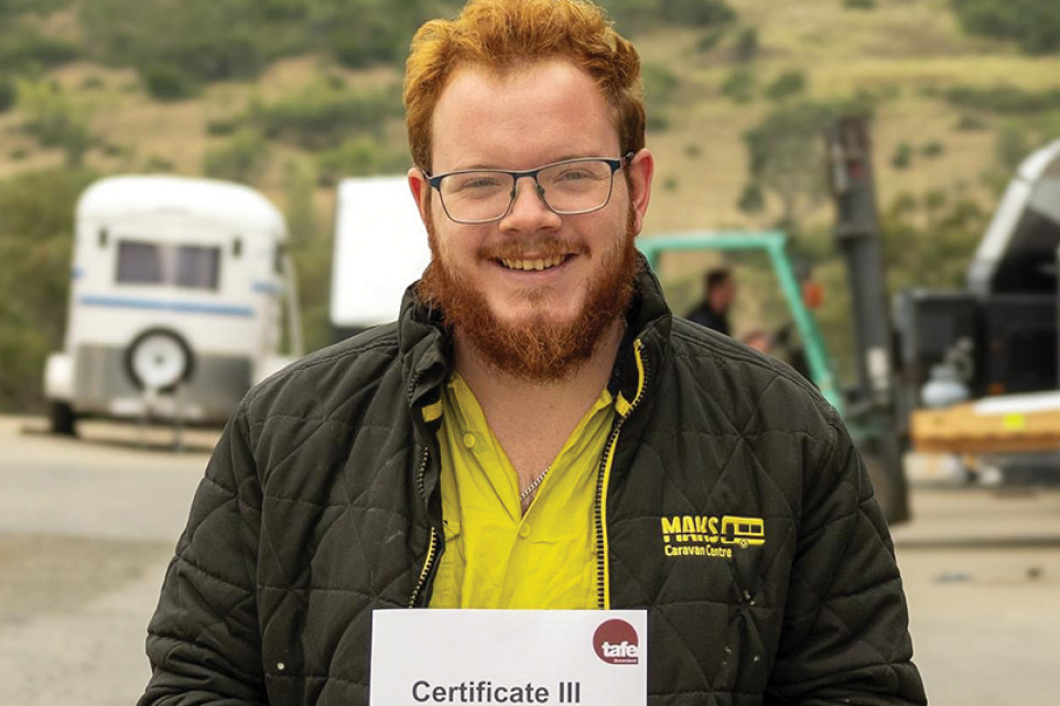 Recreational vehicle mechanic Zackary Tozer, who works at MAKS Caravan Centre in Glenvale, with his Trade Certificate.